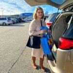 eMeals customer holding a walmart bag for eMeals