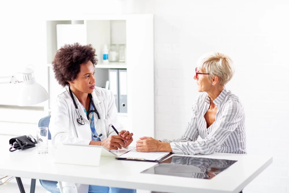 showing a patient talking to her doctor